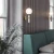 Kinkiet nowoczesny LA SPEZIA mosiądz W01343BR - Cosmo Light